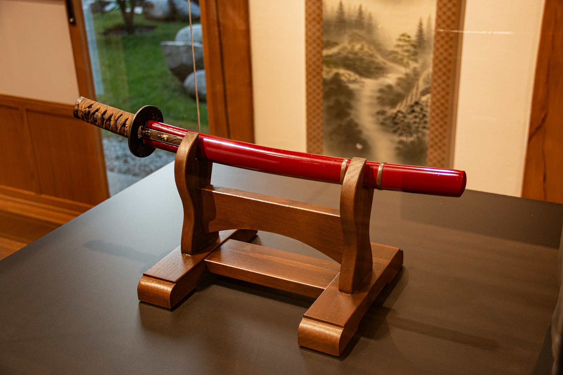 Handcrafted Japanese katana on a wooden display stand